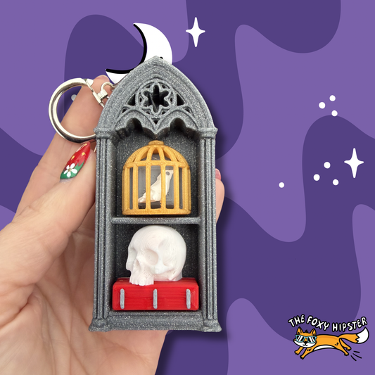 Oddities Spooky Bookshelf with Birdcage and Skull Fidget Clicker Keychain